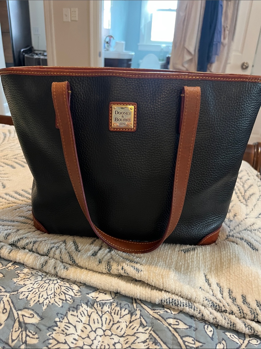 Dooney & Bourke Black Pebbled Leather Duffel with Brown Trim